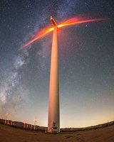 Little,Girl,And,Boy,Are,Running,In,Front,Of,Windmills.